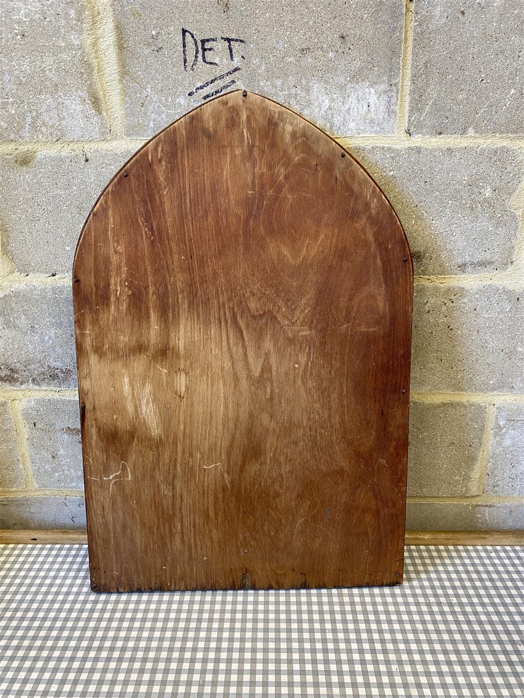 An oak lancet shaped framed wall mirror, (formerly from a dressing table) width 56cm, height 85cm